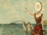woman at the beach pointing ahead with her head replaced by a blank circle