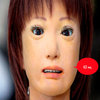 uncanny valley example of an ultra realistic mannequin with a creepy smile and life like doll-eyes 
