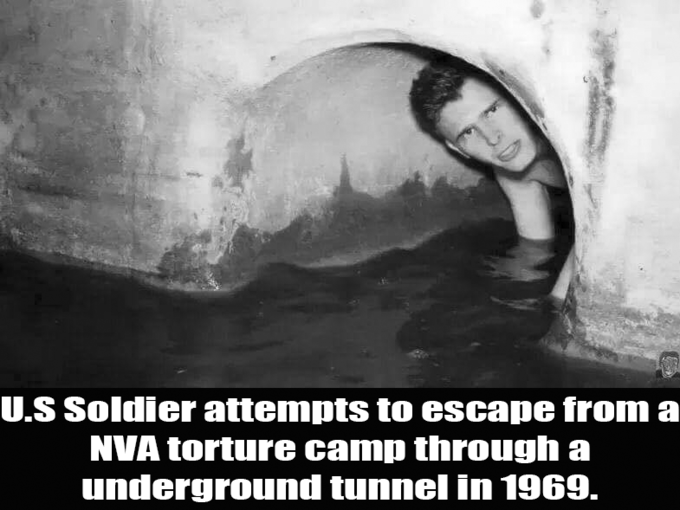 U.S Soldier attempts to escape from a NVA torture camp through underground tunnel in 1969.