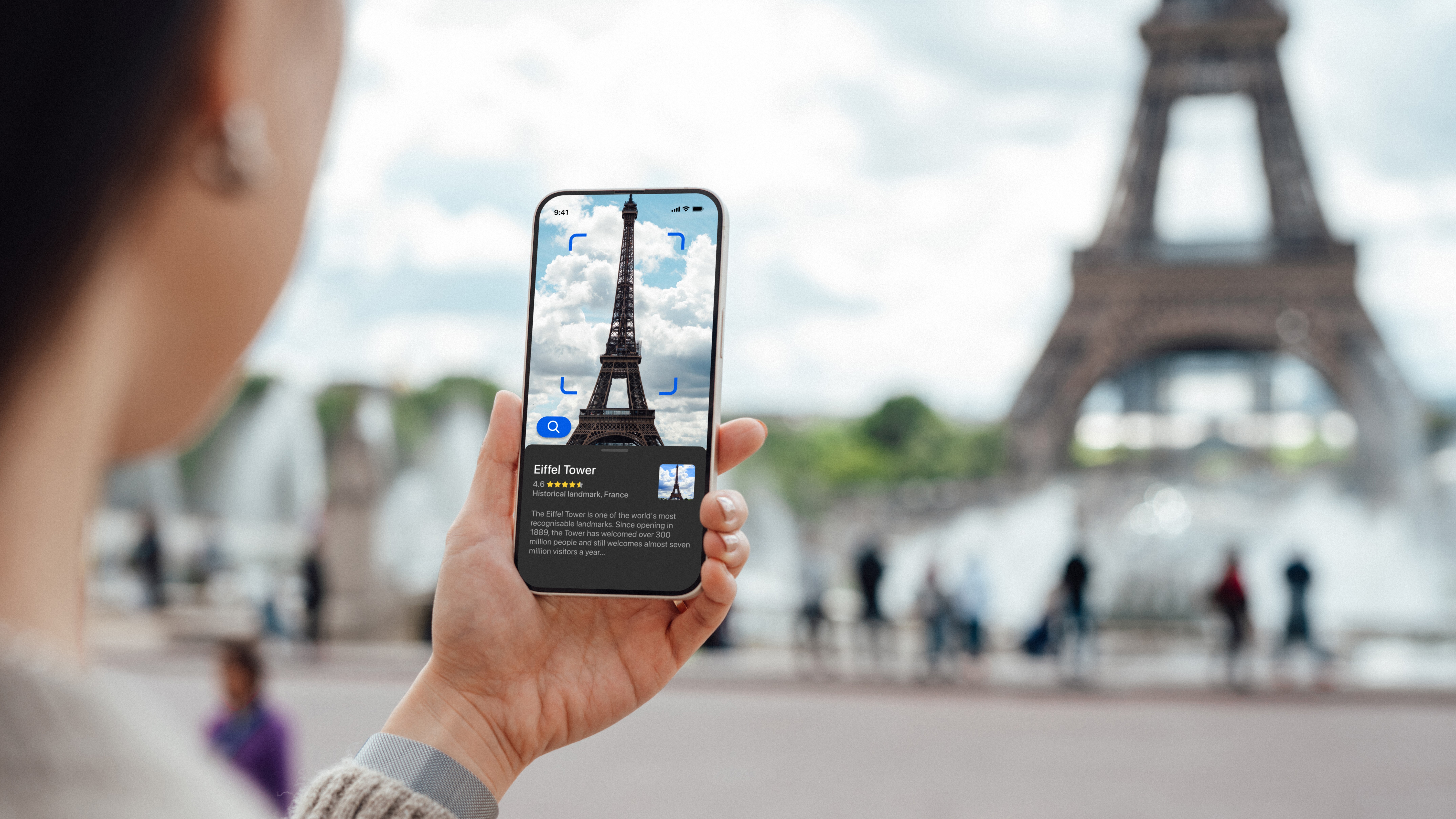 image of someone in paris taking a photo of the eiffel tower