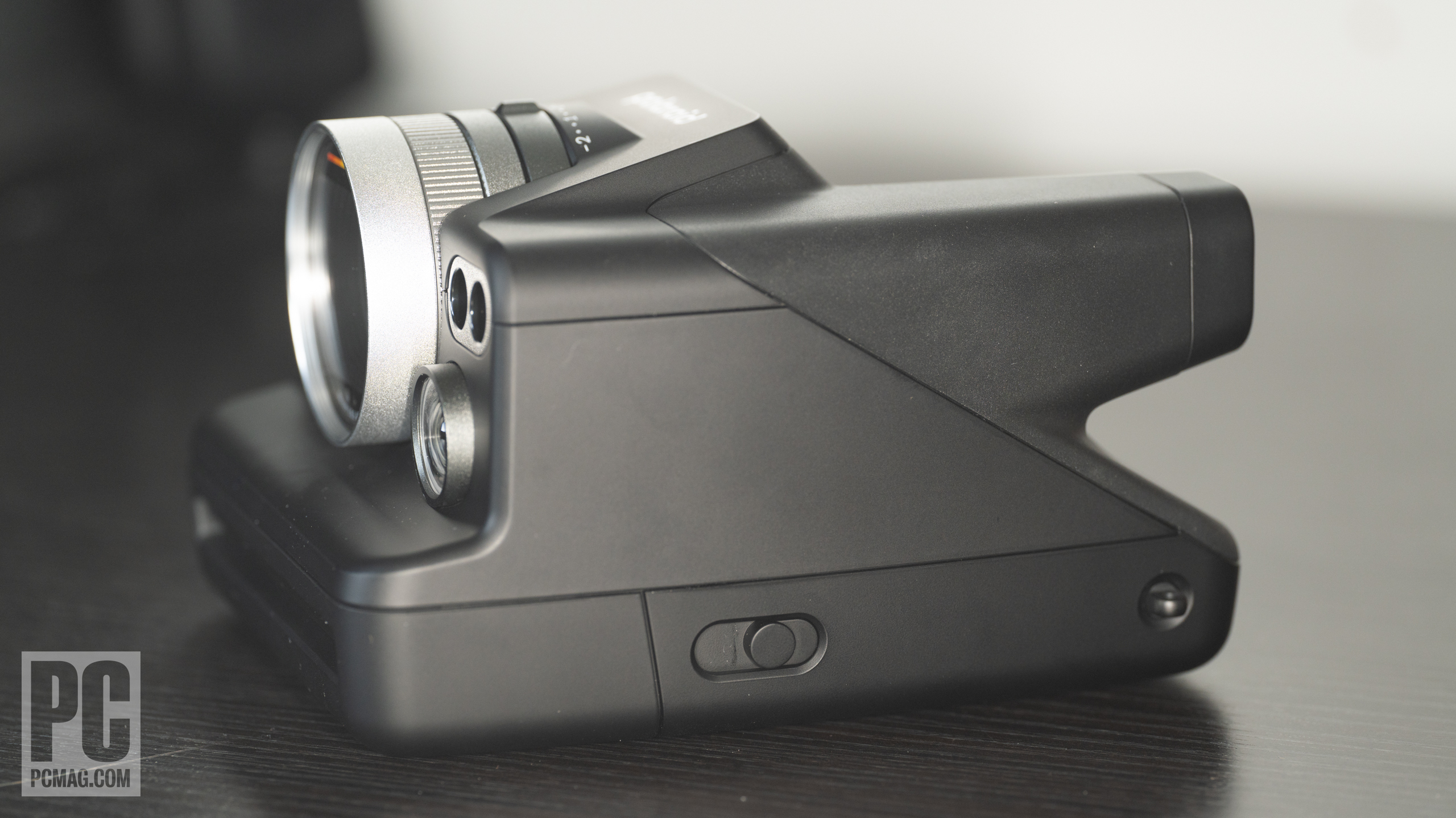 A Polaroid Instant Camera on a desk