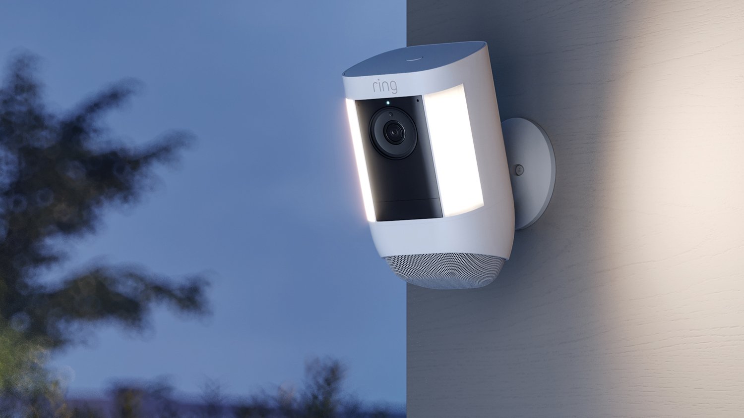 A Ring spotlight camera facing a neighborhood