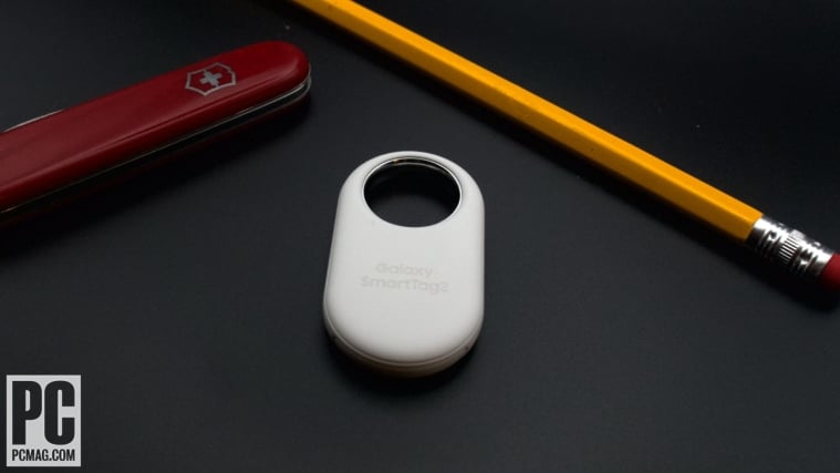Samsung SmartTag2 next to Swiss Army Knife and pencil