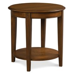 a round wooden table with one shelf on the side