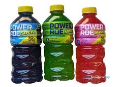 three bottles of powerade are sitting side by side