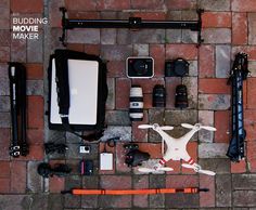an aerial view of the contents of a camera and other equipment on a brick floor