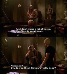 two people standing in a living room with one person talking on the phone and the other saying