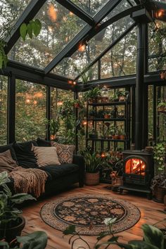 Dark Cottagecore greenhouse with black framework glass walls lush plants iron stove burning fire comfortable seating vintage shelving and circular patterned rug