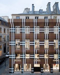 the facade of a building with many windows