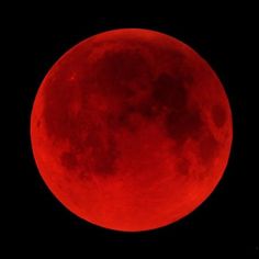 the full moon is shown in red as it appears to be on its way through the sky
