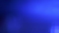 a blurry image of blue lights in the dark