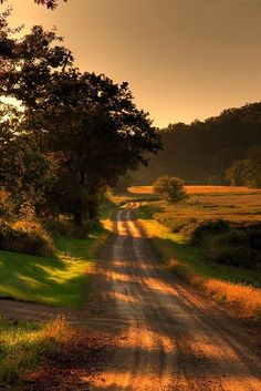 a dirt road with the words dear days that summer turned a corner into sun down that red dirt road
