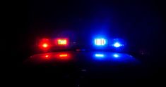 two lights on top of a police car in the dark