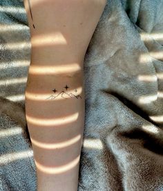 a person with a small tattoo on their arm