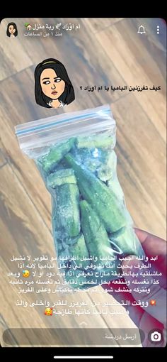 someone is holding up a bag of pickles in their hand, with an image of a woman's face on it
