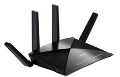 a black router with two antennas on it's sides and one is facing the camera