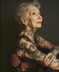 an older woman with tattoos on her body