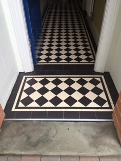 a black and white checkered floor in a hallway