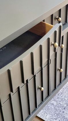 a close up of a cabinet with drawers
