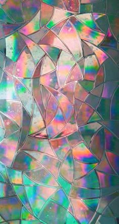 an abstract background with many different colors and shapes in the form of mosaic tiles or glass