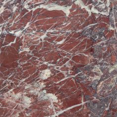 red marble textured with white and black veinies on the outside, as seen from above