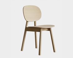 a wooden chair sitting on top of a white floor