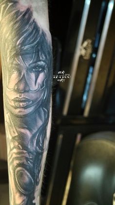 a man with a tattoo on his arm