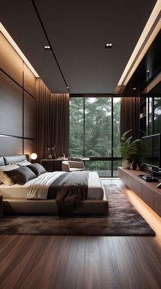 a modern bedroom with wood floors and large windows overlooking the trees in the distance is lit up by lights
