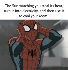 the spider - man is sitting in front of his head