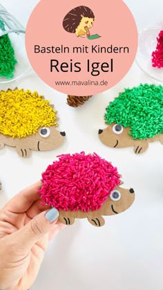 a hand holding a piece of paper that has been made to look like a hedge