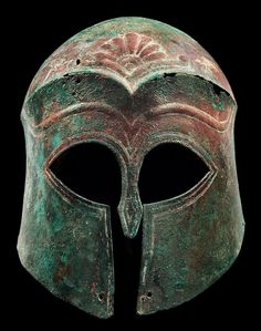 an ancient roman helmet is shown against a black background