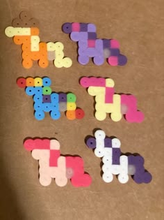the letters are made out of wooden pegs and have been cut into smaller shapes