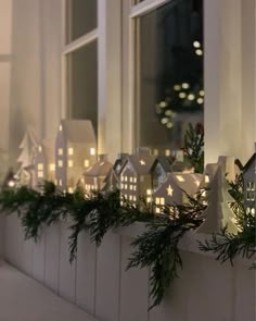 christmas lights are placed on the windowsill