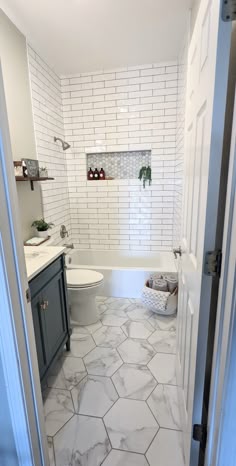Guest Bathroom Remodel with White Tile and Gray Cabinets
