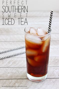 an iced drink in a tall glass with ice