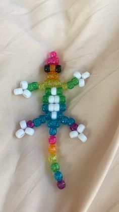 Rainbow Kandi/ pony bead gecko! 🦎 🌈💗 in 2025 | Pony beads, Pony bead crafts, Pony bead projects