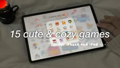 a person holding an ipad with the text 15 cute & cozy games for iphone and ipad