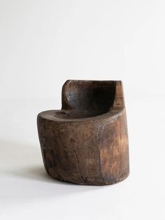 a wooden chair sitting on top of a white floor