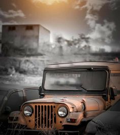 an old jeep parked in the middle of nowhere
