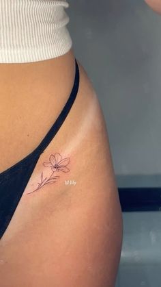#tattoo #lilytattoo #lily #flower #flowertattoo #tattooideas #tattooinspo #hiptattoo #finelinetattoo #tattoosforwomen #tattooinsperation #tattooed #tattooplacement Mini Tattoos Flower Simple, Women With Dainty Tattoos, Hip Tattoo Inspiration, Little Tattoo Placements, Spud Tattoo, Tattoo Hip Ideas, Delicate Tattoo Ideas For Women, Mini Feminine Tattoos, Birth Flower Hip Tattoo
