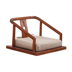 a wooden chair with a cushion on it