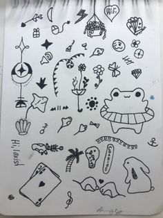 some drawings on a piece of paper that is white and has black ink in it