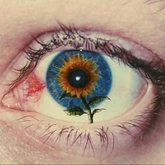 an eye with blue and yellow iris is shown