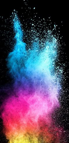 colorful powder exploding in the air on a black background