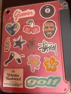 a pink case with many stickers on it