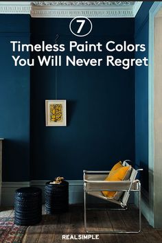 a blue room with yellow pillows and a white chair in the corner that says 7 times paint colors you will never regt