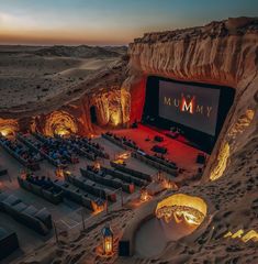 an outdoor movie theater in the middle of desert