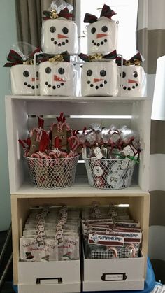 a shelf filled with christmas gifts and snowmen