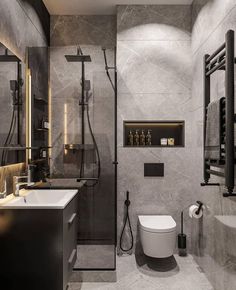 a bathroom with a toilet, sink, and shower in grey marbled colors on the walls