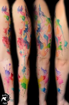 colorful ink splattered on the legs of someone's leg and arm, with different colors